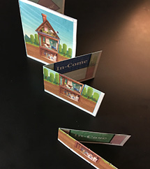 Mini mockup of multipage educational booklet with an interactive house illustration to explain the company’s financial philosophy.
