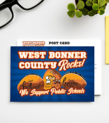 Branded Post cards on a table, ready to go out and mobilize the community.